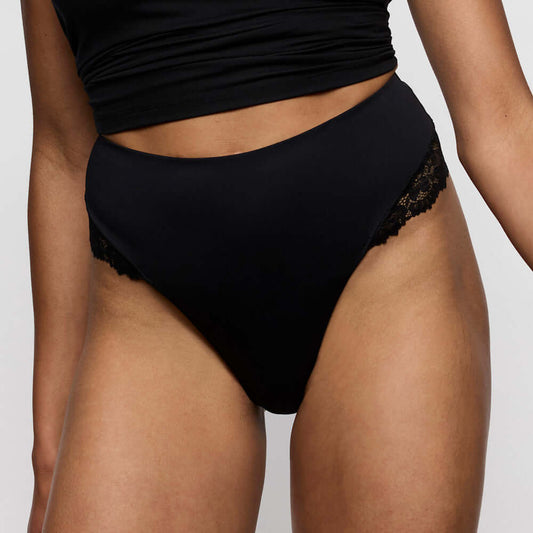 Marie Jo Soft Studio Smoothing Thong in Black showcasing exquisite softness and a sexy streamlined look.