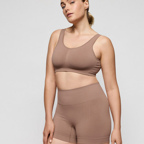 Primadonna NUDDA shapewear shorts in ginger - booty lifting shorts displayed on a model.