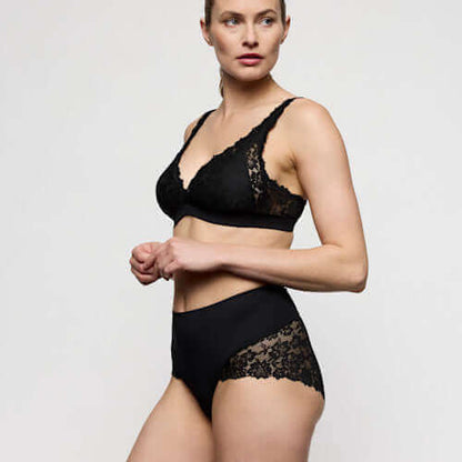 Marie Jo smoothing briefs 3 pack in black displayed with matching lace bralette on a model.