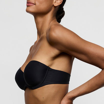Marie Jo Tom Padded Bra Strapless in Charcoal model wearing the bra from the side for a stylish look.