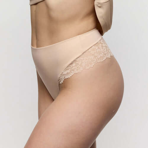 Side view of luxury thong underwear showcasing its soft fabric and lace detailing, ideal for a seamless look.