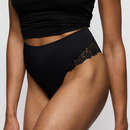 Marie Jo Soft Studio Smoothing Thong in Black showcasing exquisite softness and invisible comfort under clothing.