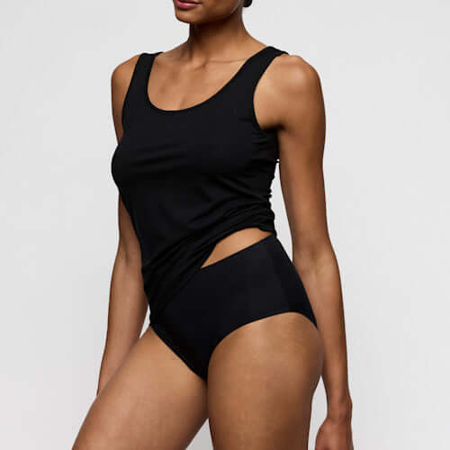 Marie Jo Soft Studio Top without cups featuring wider straps in black, offering exquisite softness and comfort.