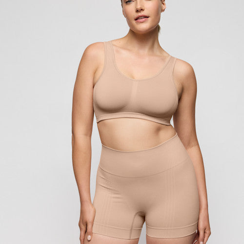 Primadonna NUDDA shapewear shorts in caffé latte - booty lifting worn by a model for a smooth, natural lift.