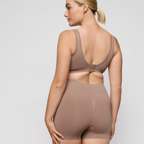 Primadonna NUDDA shapewear shorts in ginger - booty lifting shorts displayed on a model from the back.