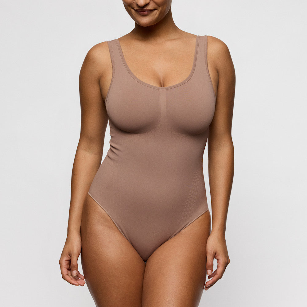 Primadonna NUDDA shapewear body in ginger on a model, showcasing a smooth silhouette and built-in wireless bra.