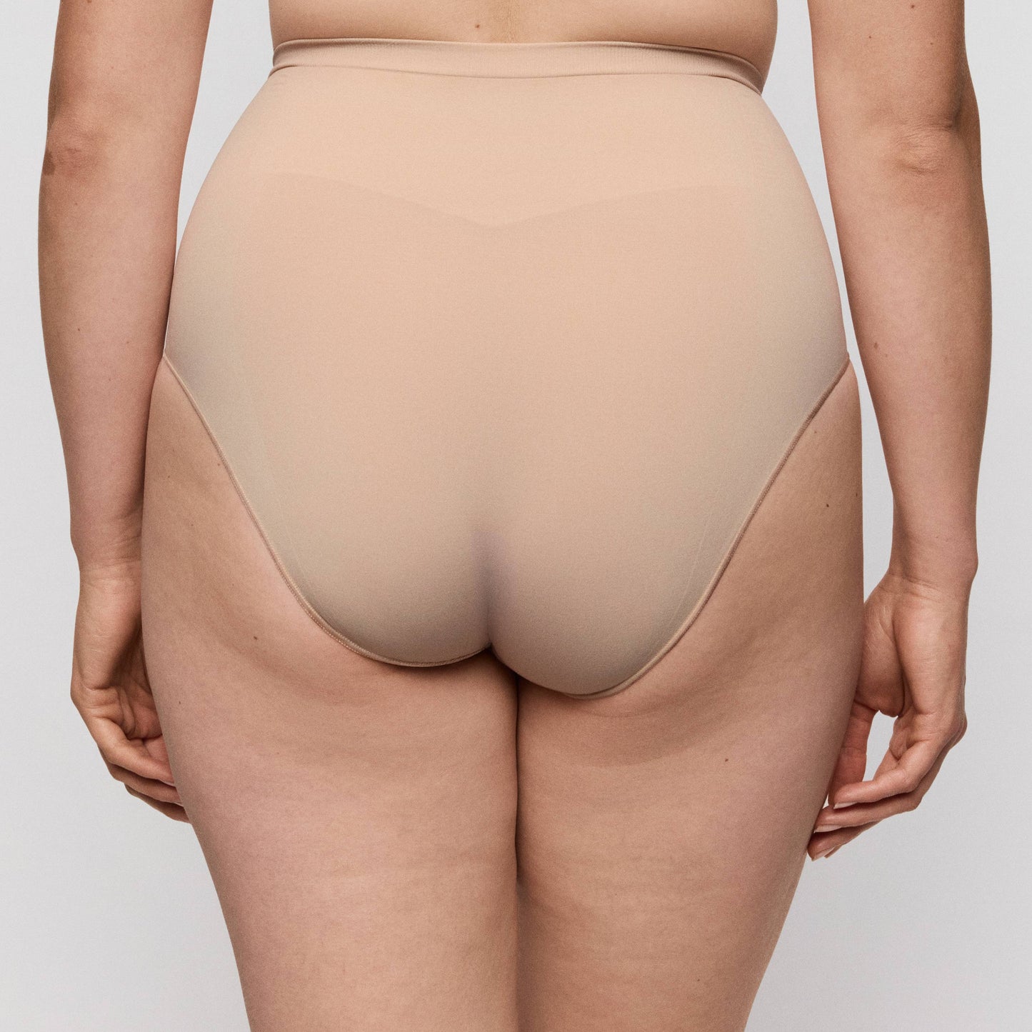 Close-up of the back view of Primadonna NUDDA shapewear high briefs in caffé latte color.