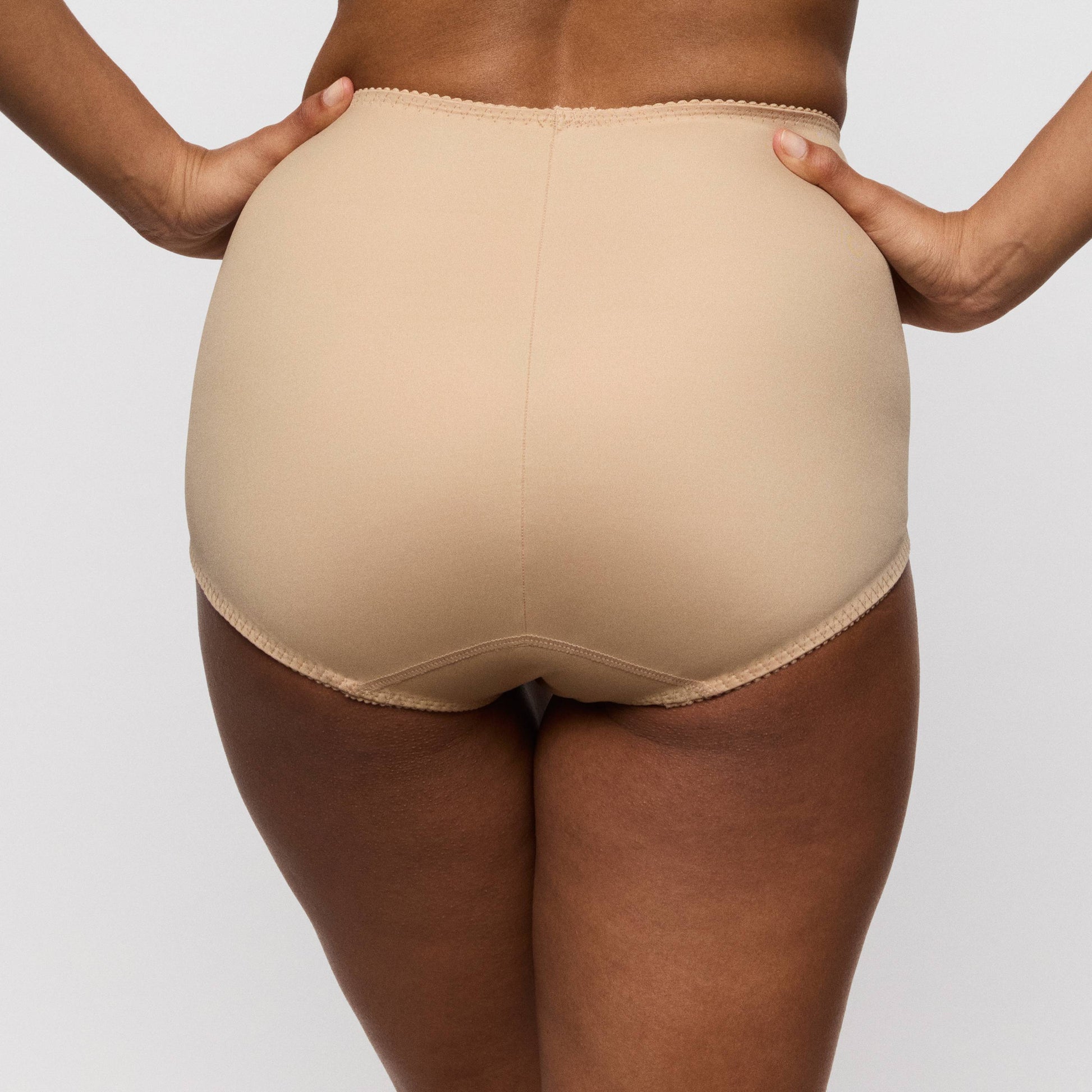 Primadonna SALERNO shapewear briefs in Candy Ginger shown from the back, highlighting the smooth high-waisted design.
