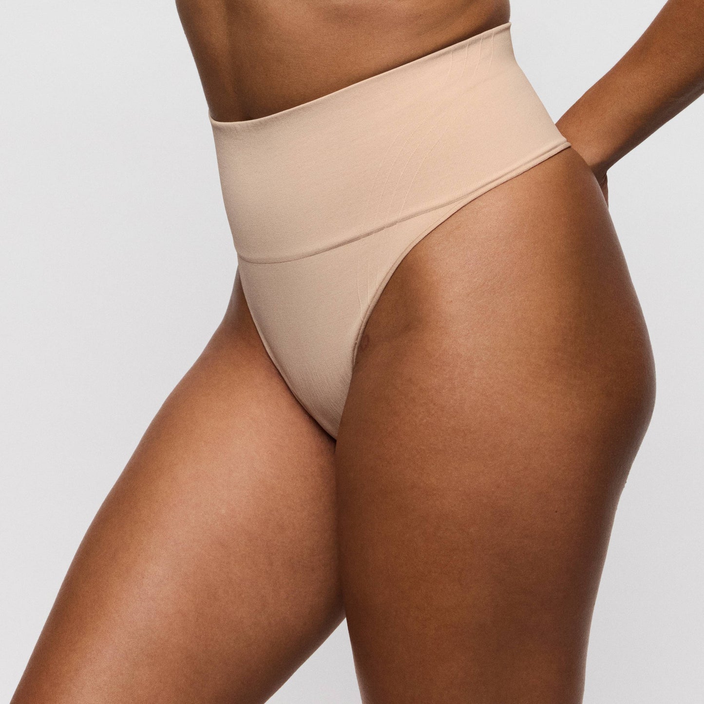 Primadonna Nudda high-waisted shapewear thong in caffé latte color, featuring smooth shaping design for comfort and style.