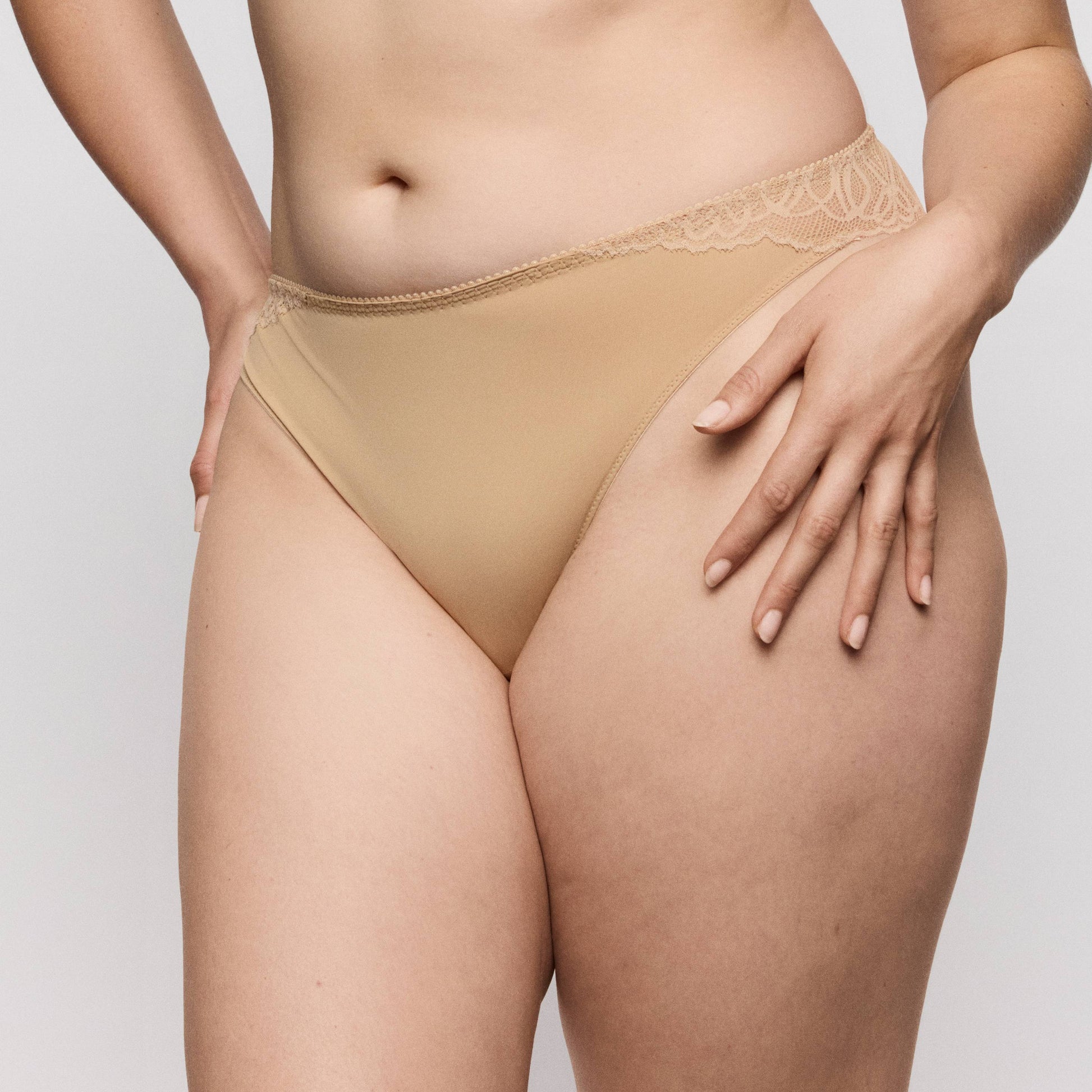 Primadonna SALERNO thong Candy Ginger on a model, showcasing a sexy streamlined look in a neutral shade.